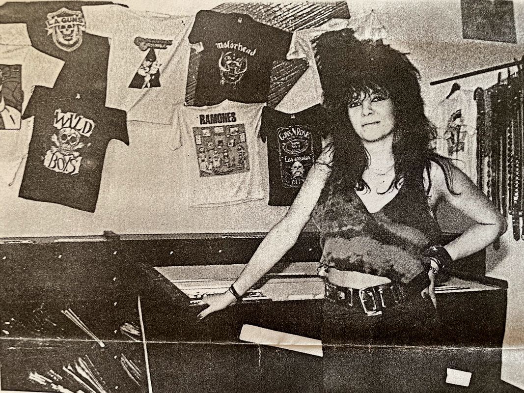 Beate in her first small RATTLESNAKE shop ca. 1989. T-Shirts were in shelves for LPs